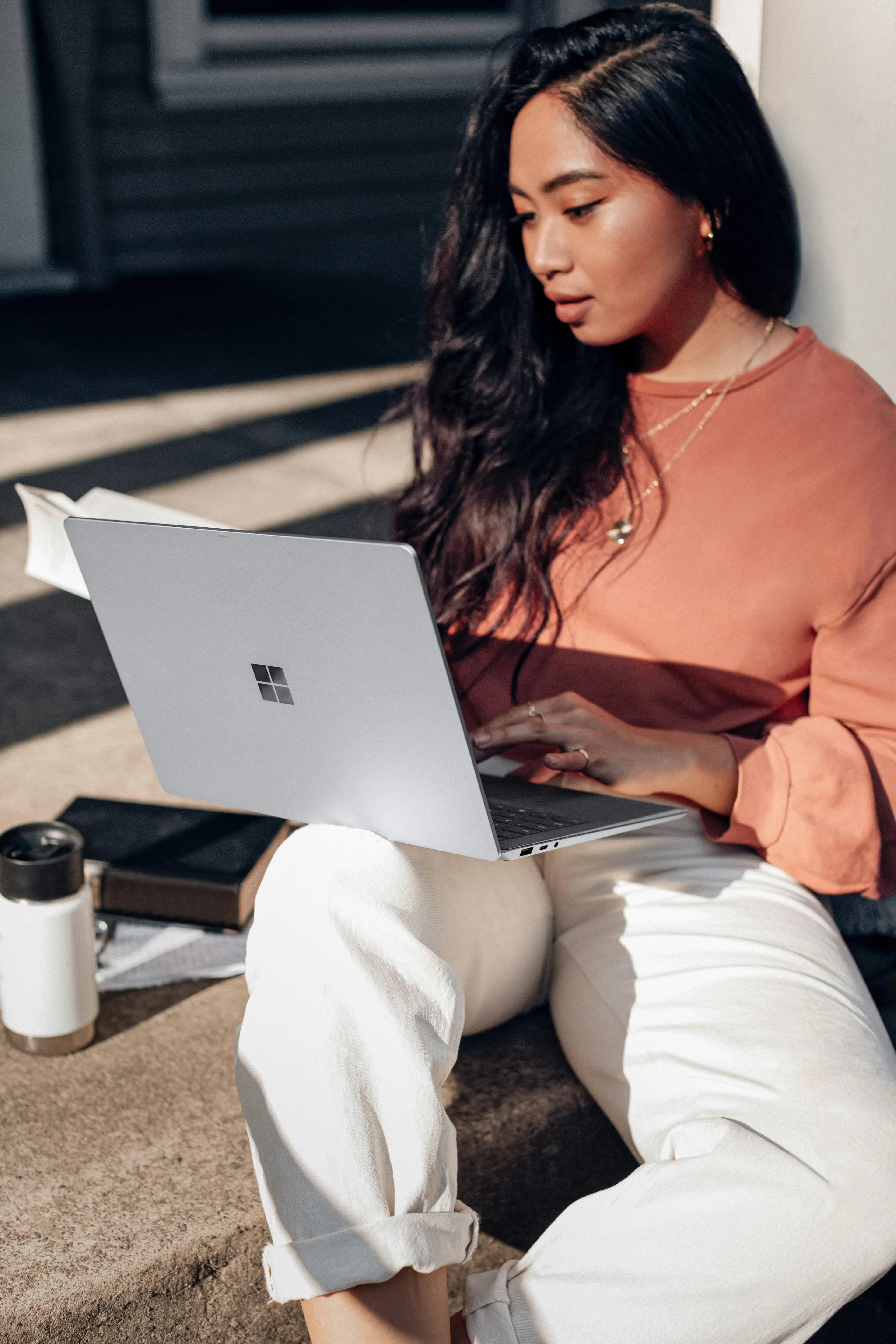 Woman reviewing information on a laptop, symbolizing checking credit reports